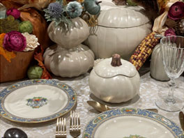 fall themed porcelain dishes on table 