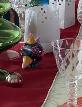 class and cutlery on red table cloth